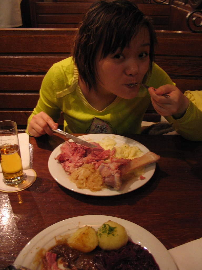 Miaomiao having dinner at a restaurant in the city center