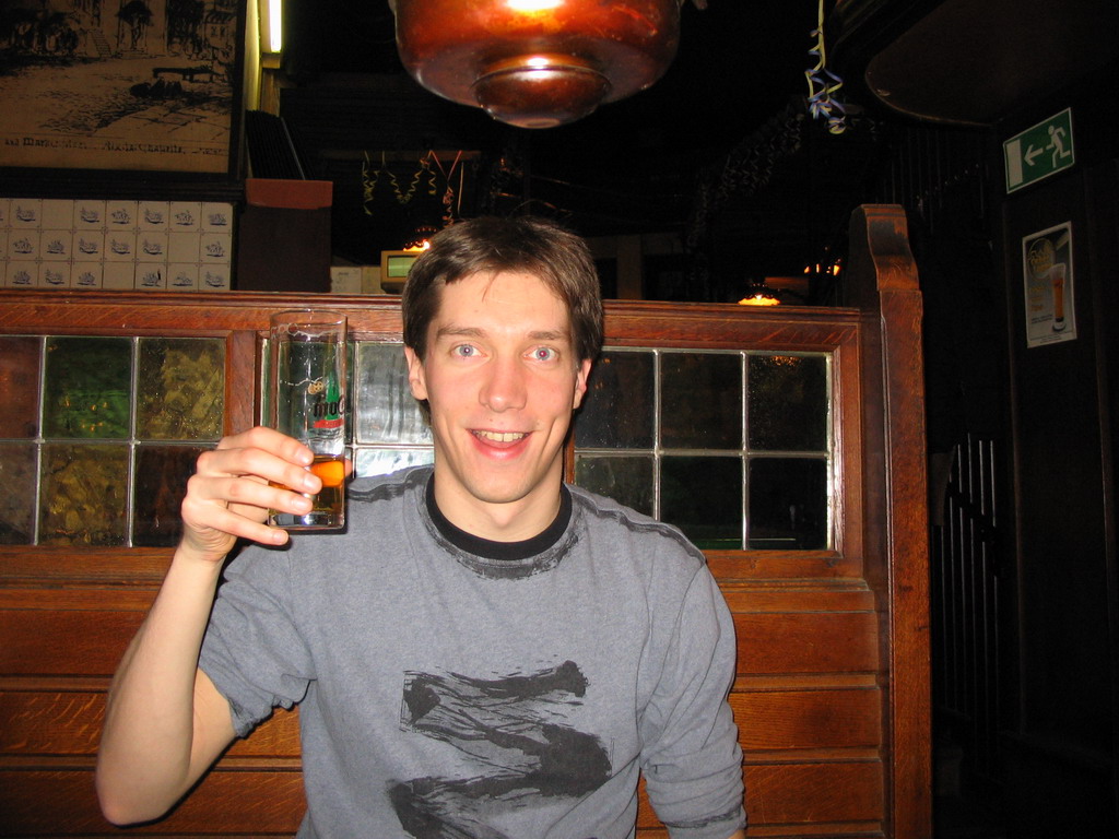 Tim with a beer at a restaurant in the city center