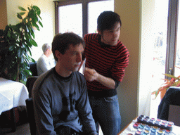 Tim getting face paint at a restaurant in the city center