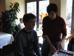 Tim getting face paint at a restaurant in the city center