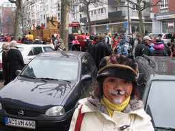 Miaomiao with face paint and the Carnaval Parade at the Theaterstraße street