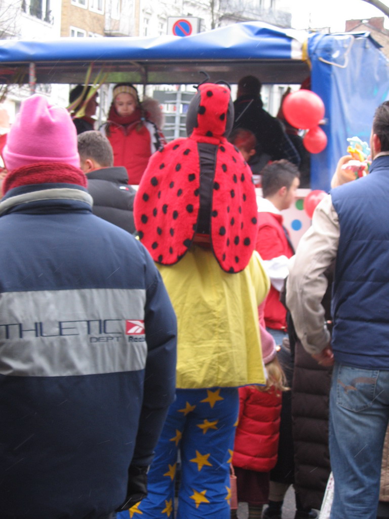 Person wearing a ladybug costume at the Theaterstraße street