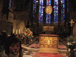 Miaomiao with face paint at the apse with the main altar, the shrine of Virgin Mary and the Aureole Madonna at the Aachen Cathedral