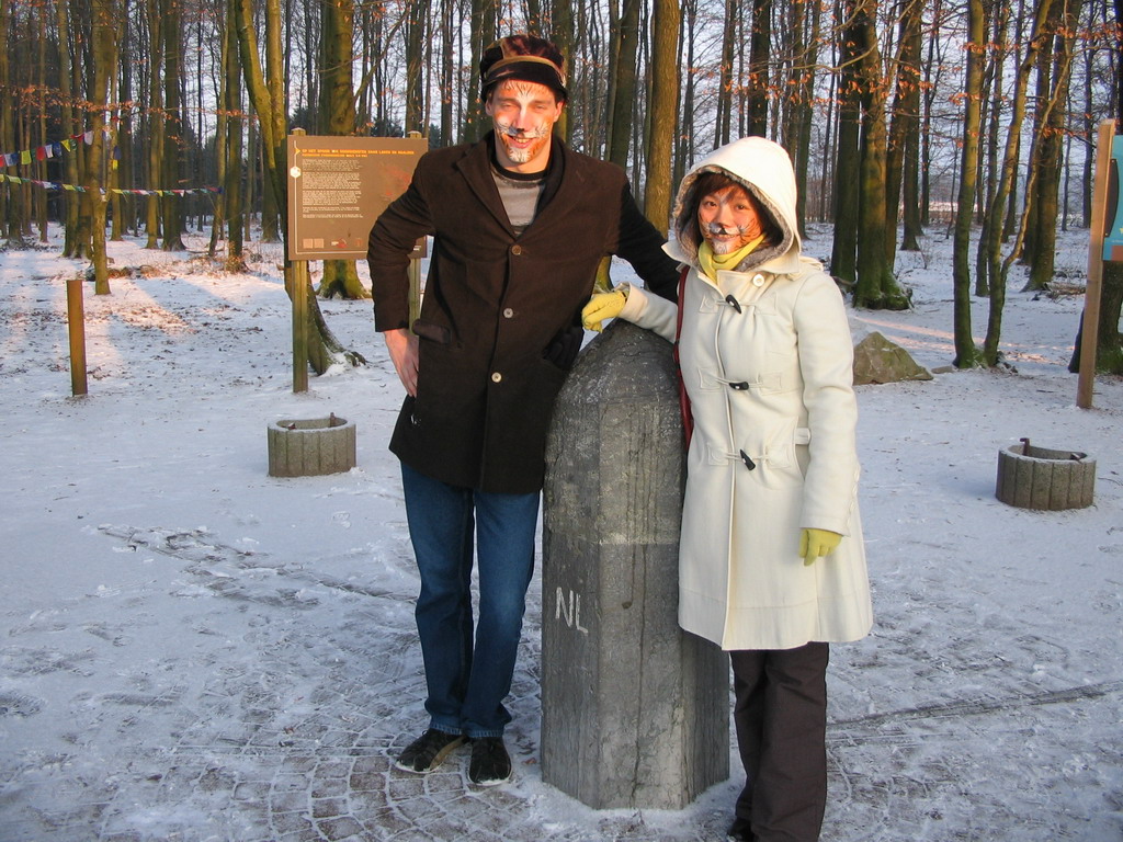 Tim and Miaomiao with face paint at the landmark at the border triangle at Vaals