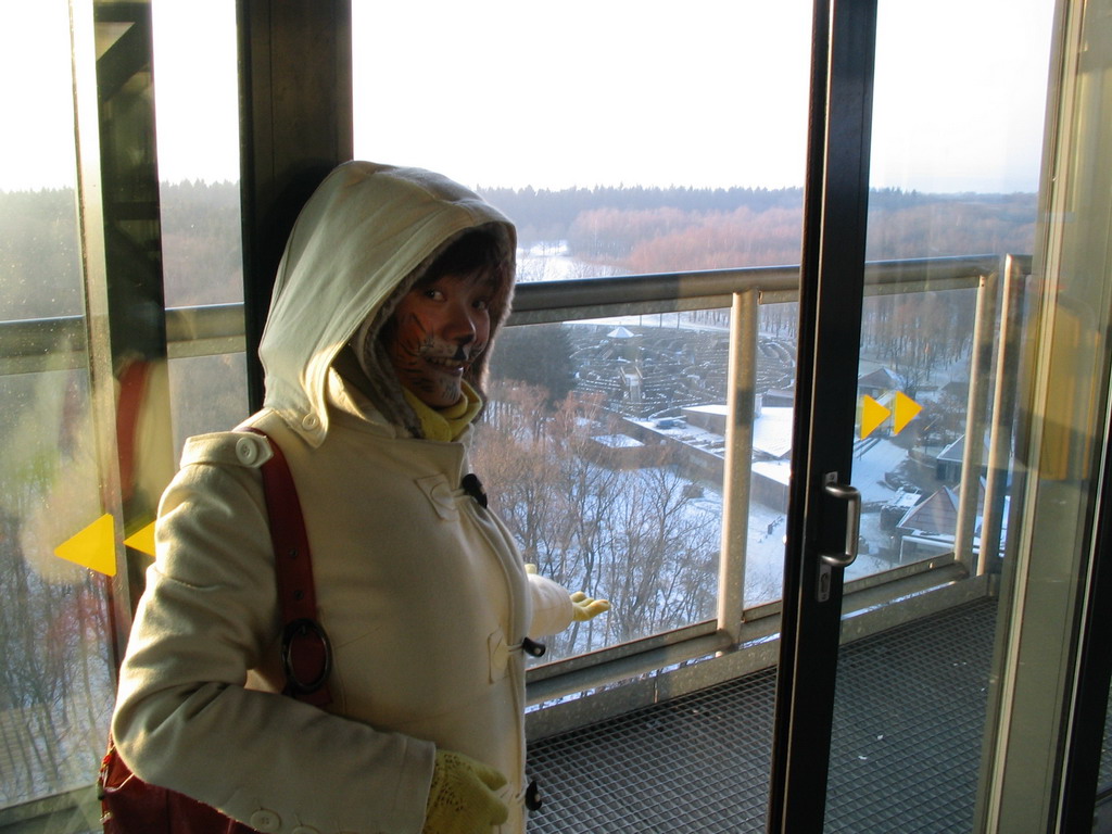 Miaomiao with face paint at the viewing tower at the border triangle at Vaals, with a view on the Drielandenpunt Labyrinth