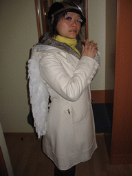 Miaomiao with fake eyelashes and angel wings in our room at the Art Hotel Aachen
