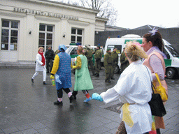 Carnaval Parade and police officers in front of the Elisenbrunnen building at the Friedrich-Wilhelm-Platz square