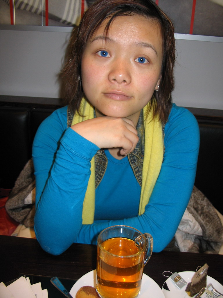 Miaomiao drinking tea at a restaurant in the city center