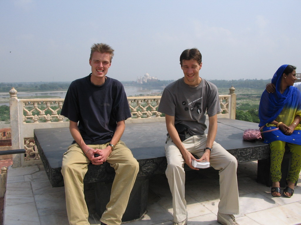 Tim and David on the Throne of Jahangir at the Agra Fort, with a view on the Taj Mahal