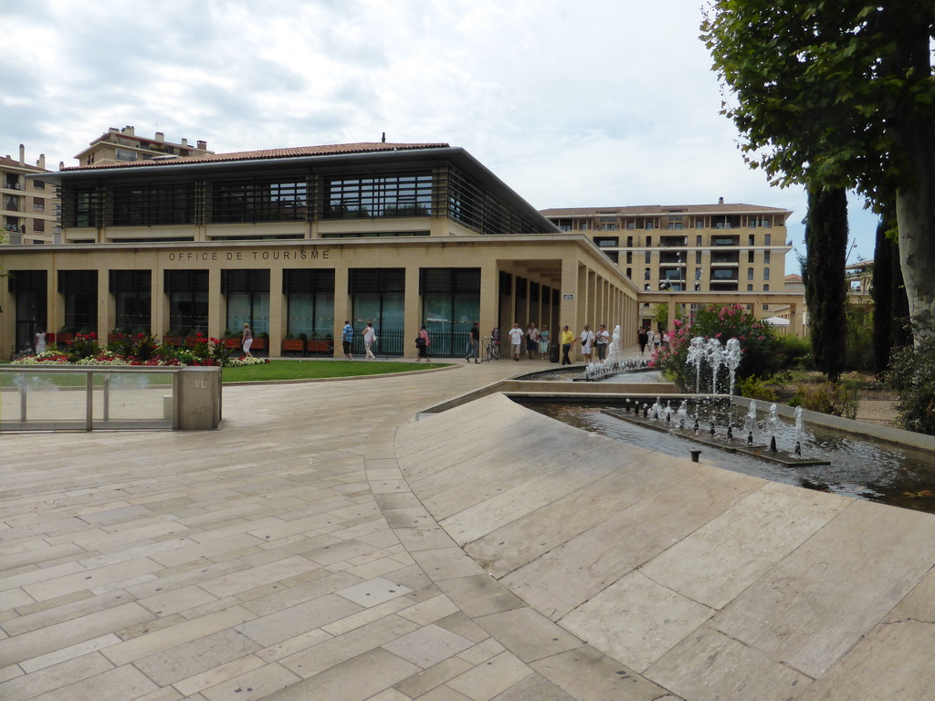 The west side of the Place de la Rotonde square with the Tourist Office and a fountain