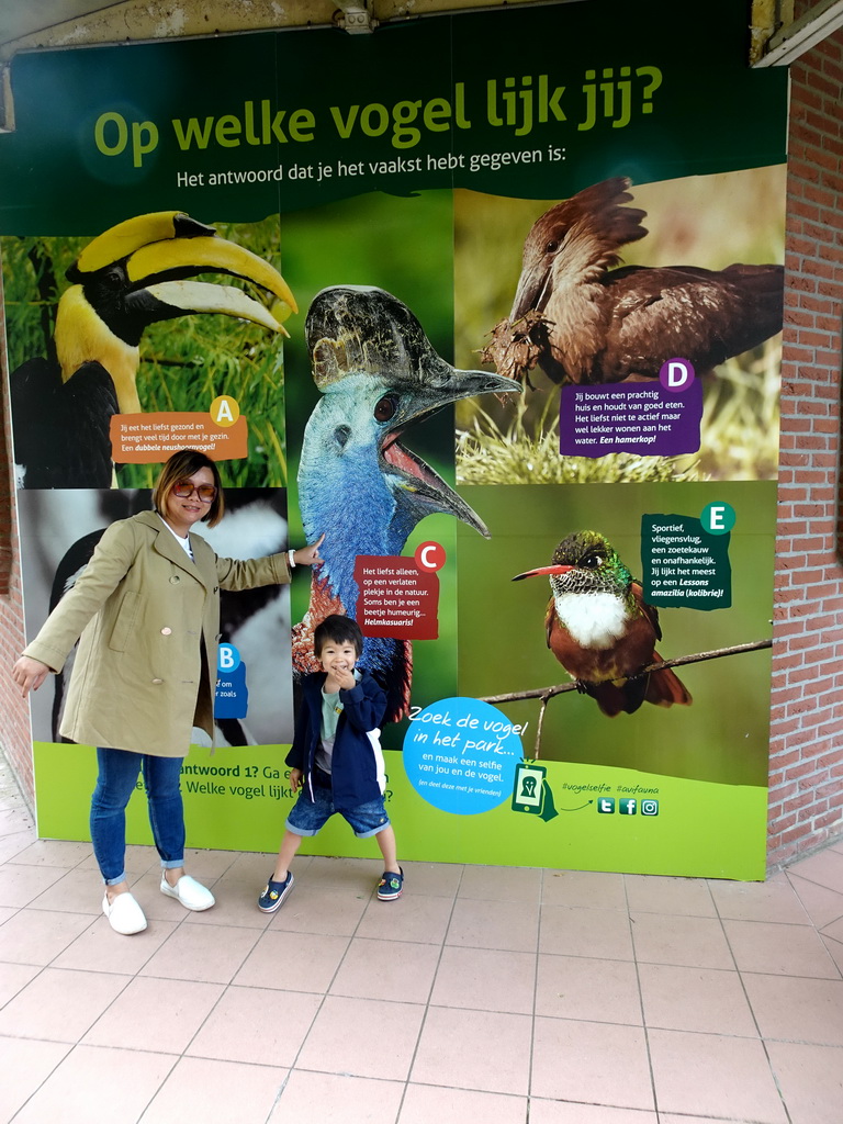 Miaomiao and Max with photographs of birds at the Vogelpark Avifauna zoo