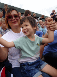 Miaomiao and Max sitting on the grandstand at the Vogelpark Avifauna zoo, just before the bird show