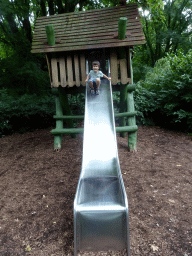 Max on a slide at the playground near the Lori Landing building at the Vogelpark Avifauna zoo