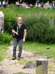 Zookeeper with a Black Kite at the Vogelpark Avifauna zoo, during the bird show