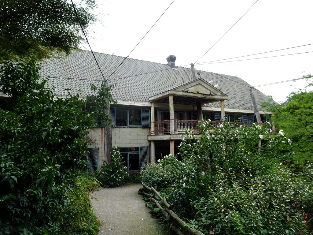 Cuba Aviary with the west side of the Casa Havana restaurant at the Vogelpark Avifauna zoo