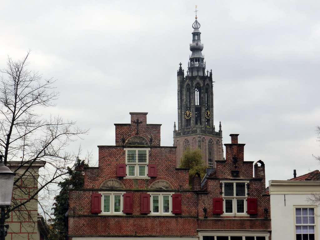 Facades of buildings at the Havik street and the Onze Lieve Vrouwetoren tower, viewed from the Bloemendalse Binnenpoort street