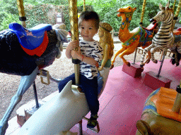 Max on a Dolphin statue at the Carousel at the Pretplein square at the DierenPark Amersfoort zoo