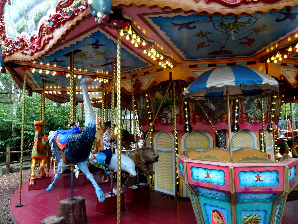 Max on a Dolphin statue at the Carousel at the Pretplein square at the DierenPark Amersfoort zoo