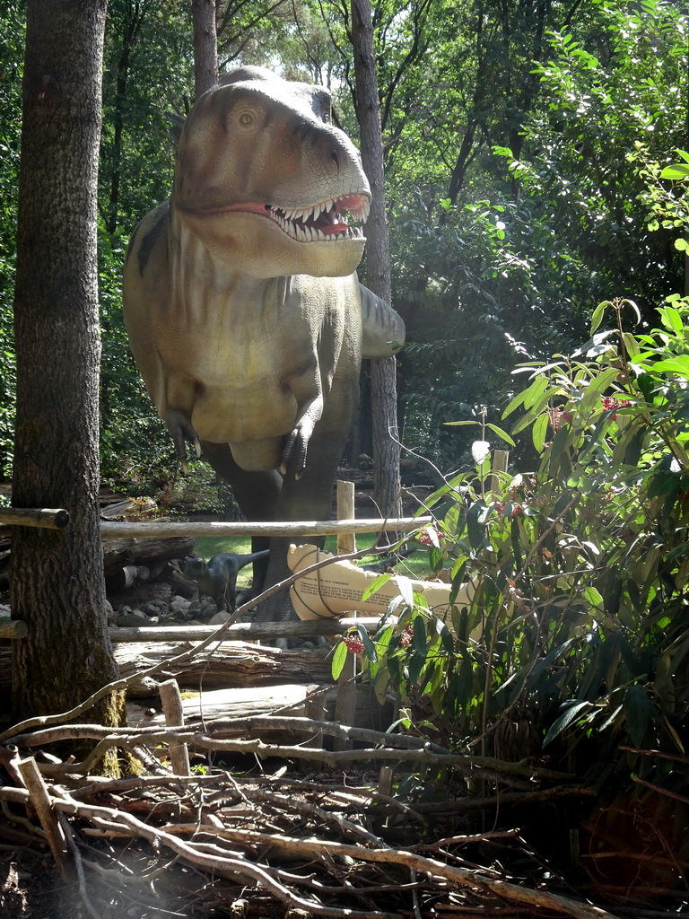Tyrannosaurus Rex statue at the DinoPark at the DierenPark Amersfoort zoo, with explanation