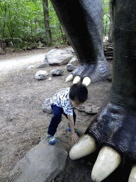 Max with a Brachiosaurus statue at the DinoPark at the DierenPark Amersfoort zoo