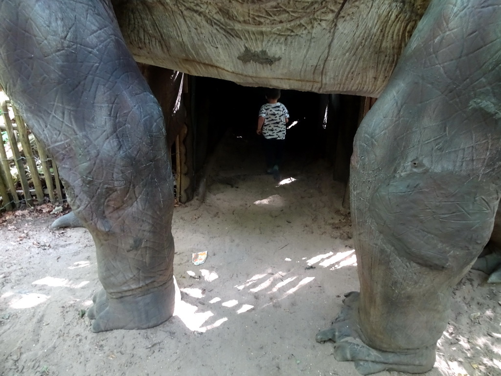 Max under a Brachiosaurus statue at the DinoPark at the DierenPark Amersfoort zoo