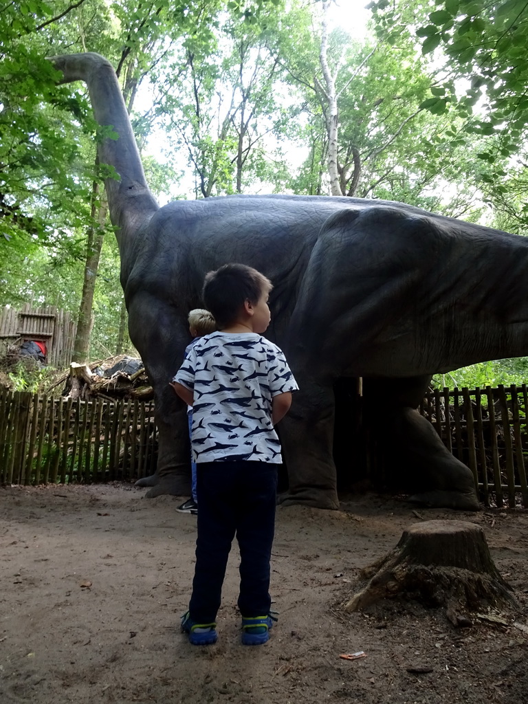 Max with a Brachiosaurus statue at the DinoPark at the DierenPark Amersfoort zoo
