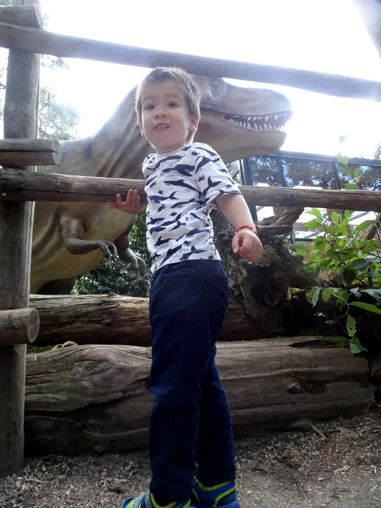 Max with a Tyrannosaurus statue at the DinoPark at the DierenPark Amersfoort zoo