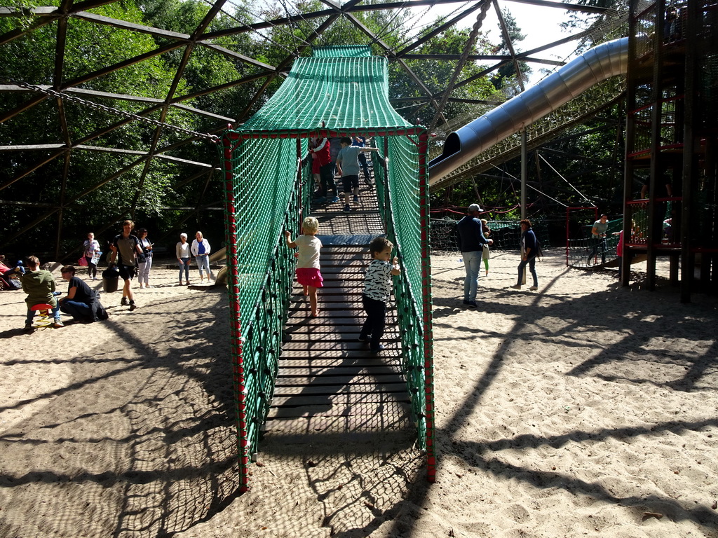 Max on a walking bridge at the playground near the Restaurant Buitenplaats at the DierenPark Amersfoort zoo