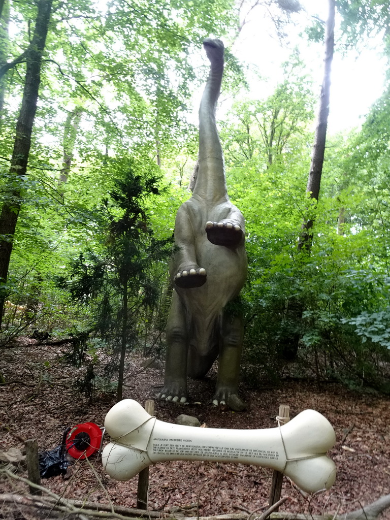 Apatosaurus statue at the DinoPark at the DierenPark Amersfoort zoo, with explanation