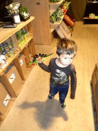 Max with dinosaur toy at the DinoShop at the DinoPark at the DierenPark Amersfoort zoo