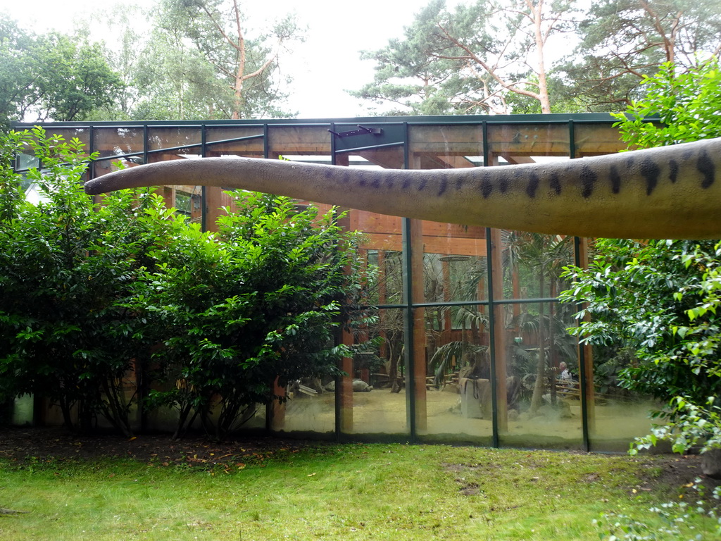 Tail of a Dinosaur statue and the Turtle Building at the DinoPark at the DierenPark Amersfoort zoo