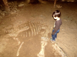 Max with a Dinosaur skeleton at an excavation site at the DinoPark at the DierenPark Amersfoort zoo