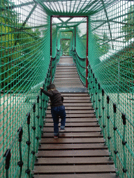 Max on a rope bridge at the playground near the Restaurant Buitenplaats at the DierenPark Amersfoort zoo