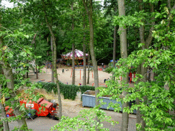 Carousel and playground at the Pretplein square at the DierenPark Amersfoort zoo, viewed from the parking garage