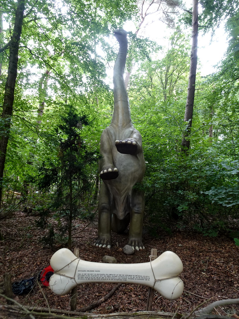 Apatosaurus statue at the DinoPark at the DierenPark Amersfoort zoo, with explanation