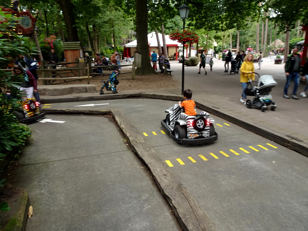 Max in a bumper car at the Pretplein square at the DierenPark Amersfoort zoo