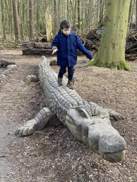 Max on a Crocodile statue at the DinoPark at the DierenPark Amersfoort zoo