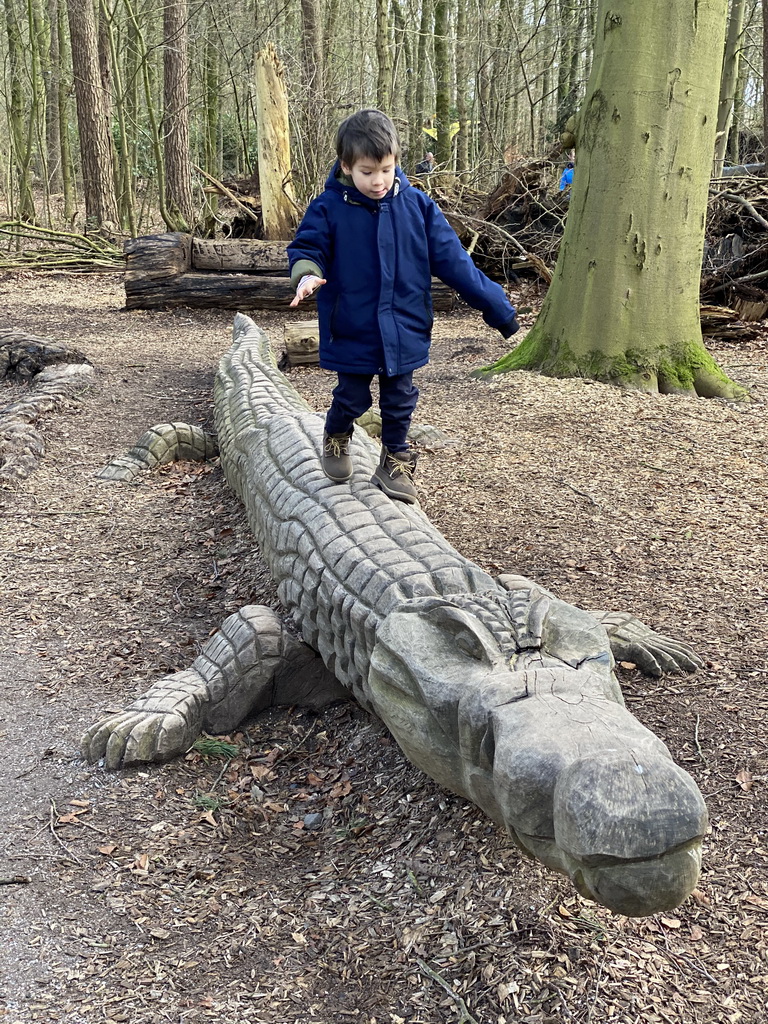 Max on a Crocodile statue at the DinoPark at the DierenPark Amersfoort zoo