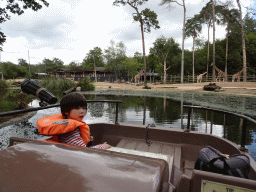 Max on the cycle boat on the Expedition River at the DierenPark Amersfoort zoo, with a view on the Giraffes and East African Oryxes