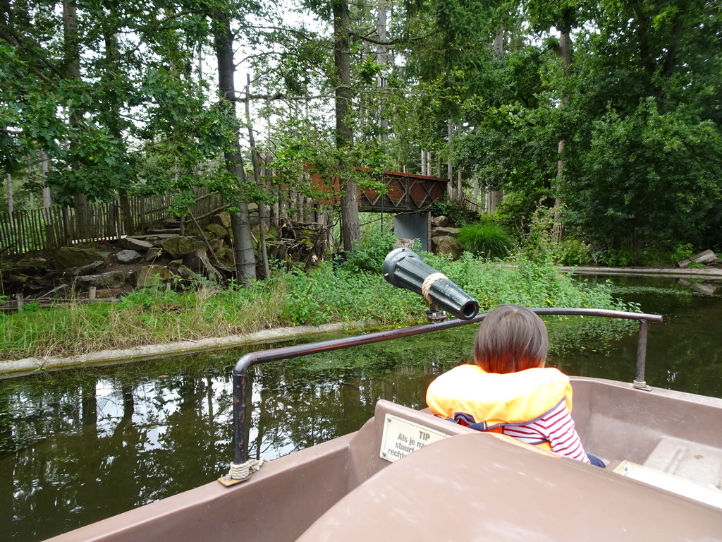 Max on the cycle boat on the Expedition River at the DierenPark Amersfoort zoo, with a view on the island with the Ring-tailed Lemurs