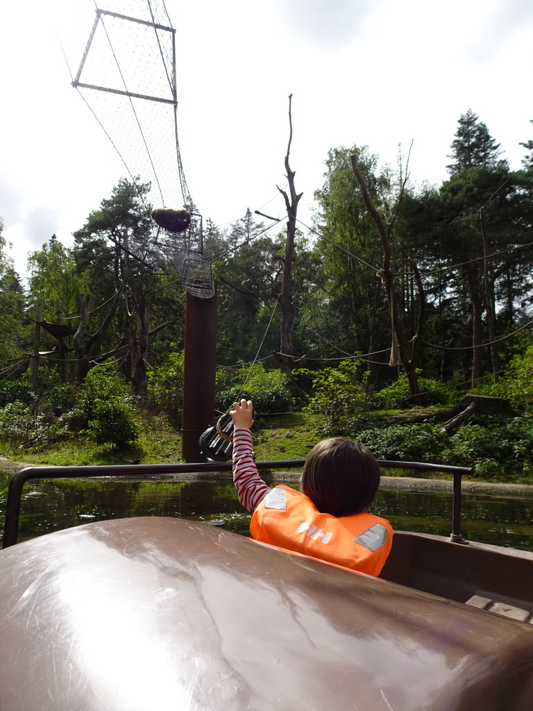 Max on the cycle boat on the Expedition River at the DierenPark Amersfoort zoo, with a view on the island with Golden-bellied Capuchins