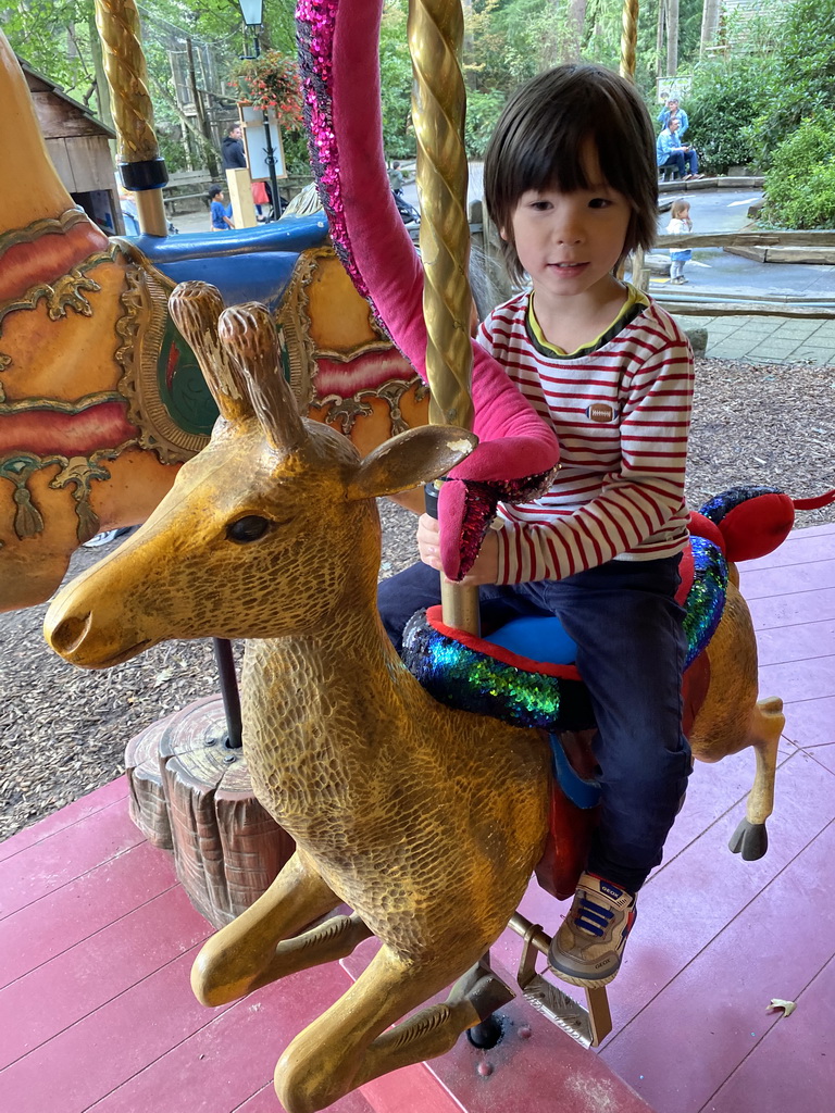 Max on a Deer statue at the Carousel at the Pretplein square at the DierenPark Amersfoort zoo