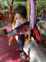 Max on a Dolphin statue at the Carousel at the Pretplein square at the DierenPark Amersfoort zoo