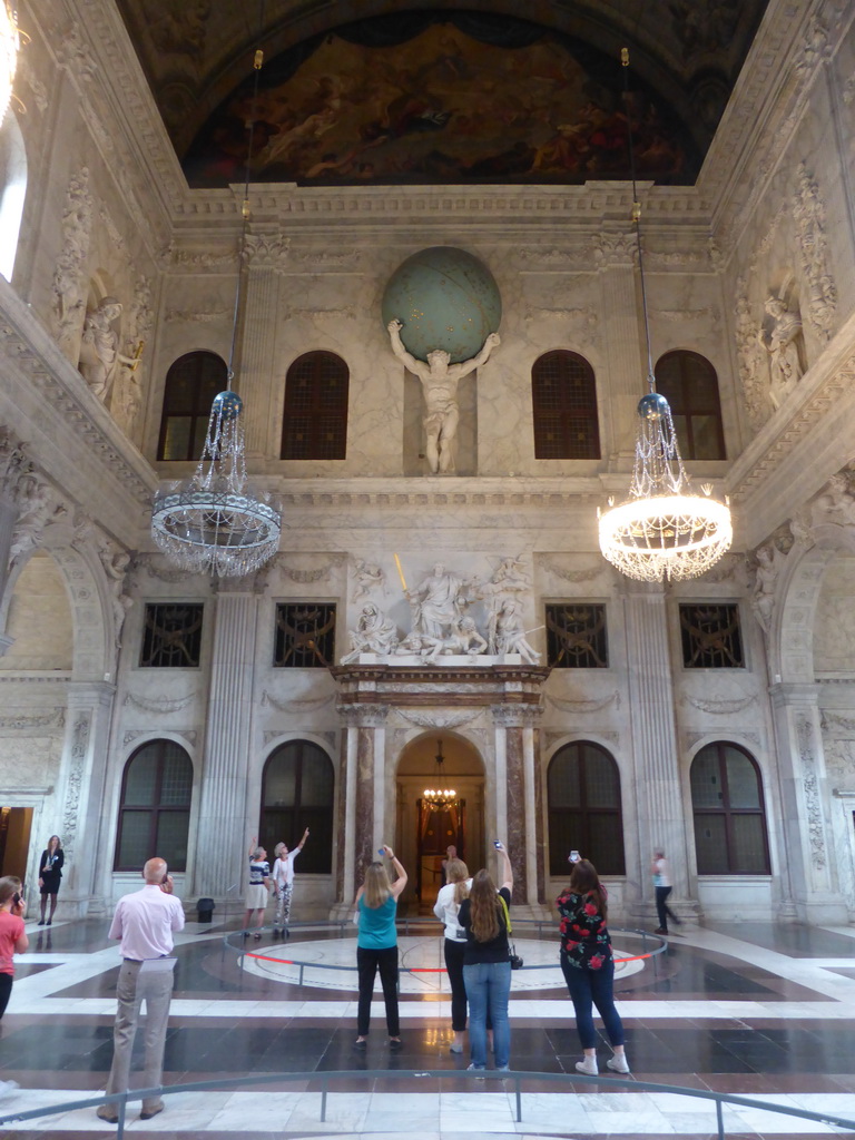 West side of the Citizen`s Hall with the Atlas statue and a world map on the floor at the First Floor of the Royal Palace Amsterdam