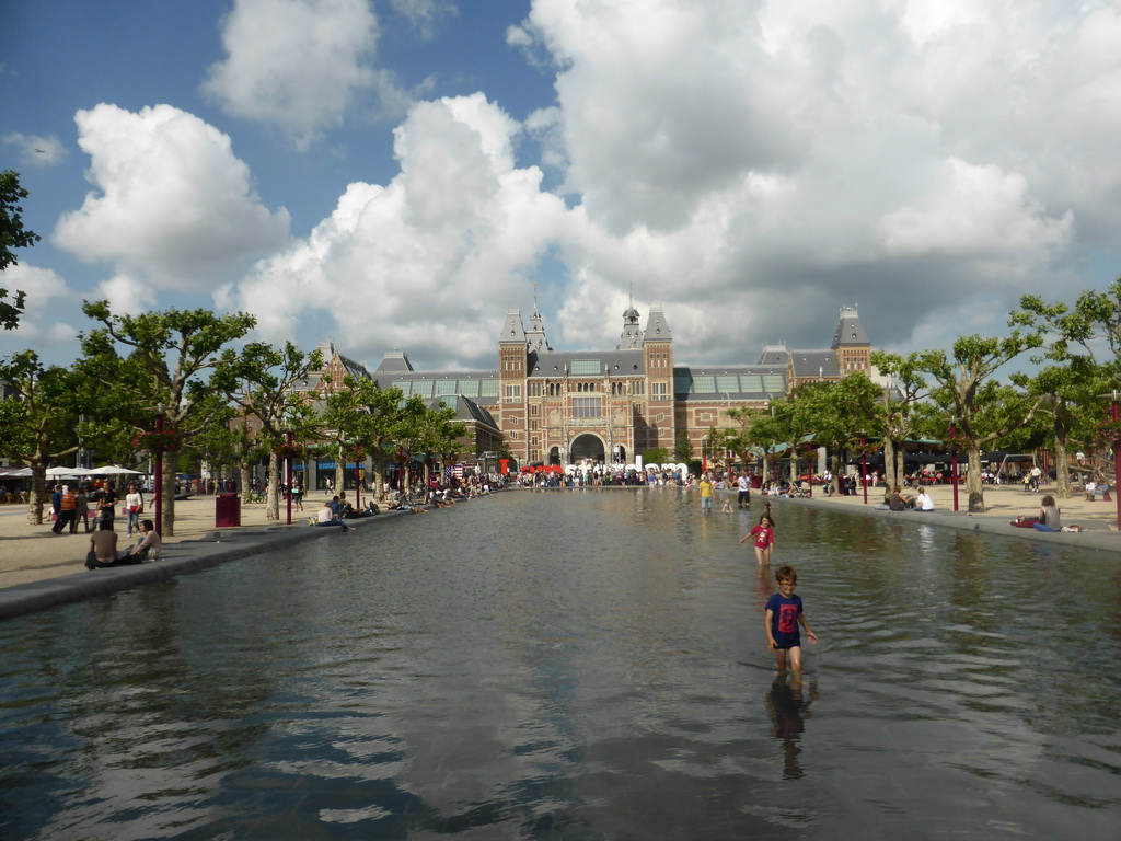 Pond in front of the `I amsterdam` text and the southwest side of the Rijksmuseum at the Museumplein square
