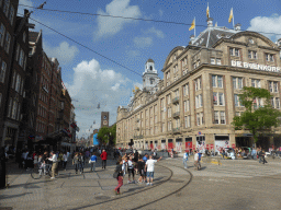 The Damrak street with the Bijenkorf department store and the Beurs van Berlage building