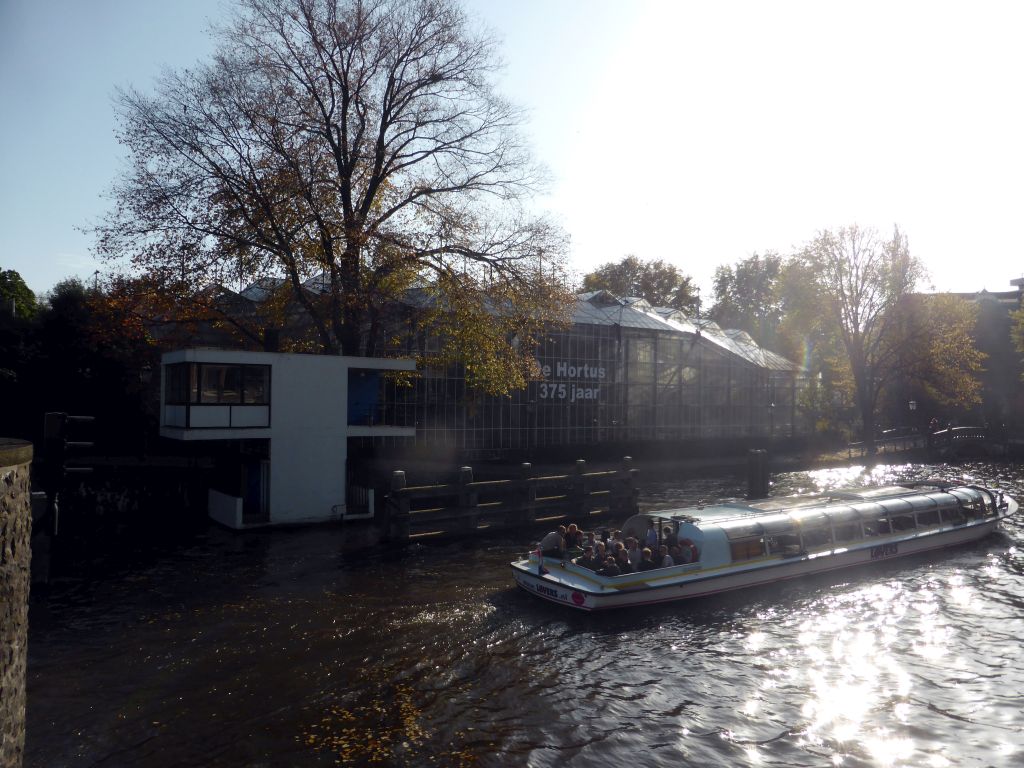 Boat in the Nieuwe Herengracht canal and the Hortus Botanicus Amsterdam botanical garden