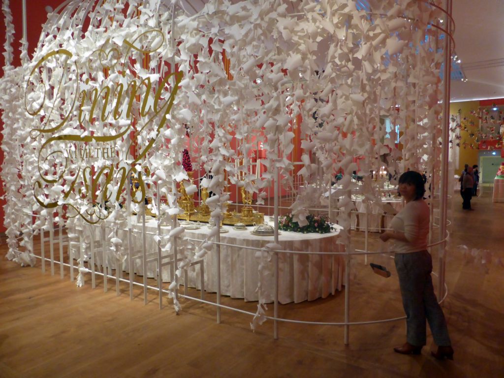 Miaomiao in front of the exhibition `Dining with the Tsars` at the Main Hall at the First Floor of the Hermitage Amsterdam museum