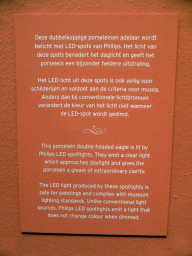 Explanation on the porcelain double-headed eagle at the exhibition `Dining with the Tsars` at the Main Hall at the First Floor of the Hermitage Amsterdam museum