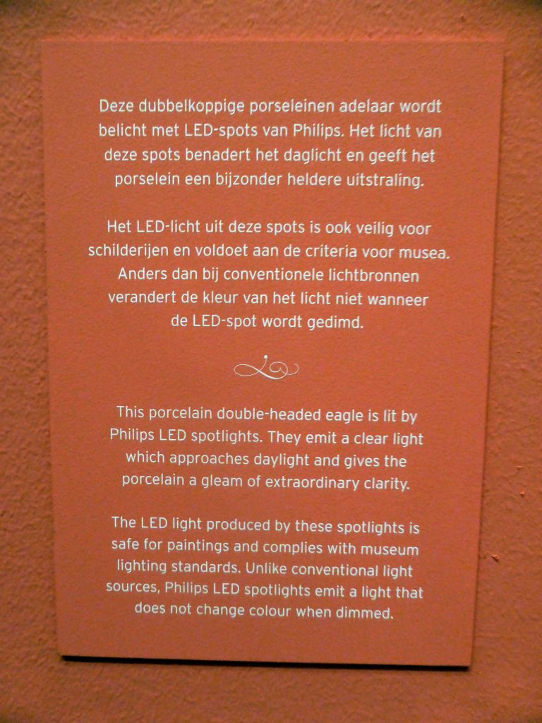 Explanation on the porcelain double-headed eagle at the exhibition `Dining with the Tsars` at the Main Hall at the First Floor of the Hermitage Amsterdam museum
